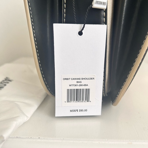 Jason Wu
Orbit Canvas / Leather Shoulder Bag NWT Color Beige/ Black - Picture 12 of 14